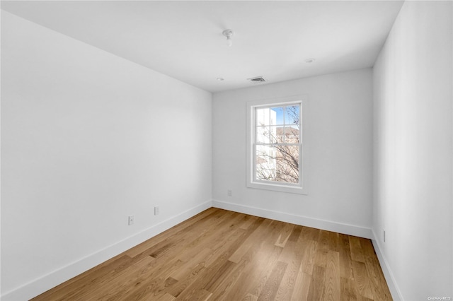 unfurnished room featuring light wood-type flooring