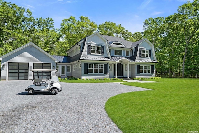 293 Beaver Dam Rd, Brookhaven, NY 11719 - shingle-style home with gravel driveway, a standing seam roof, a front lawn, metal roof, and a gambrel roof
