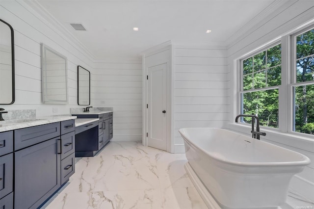 bathroom featuring crown molding, a tub to relax in, vanity, and wood walls