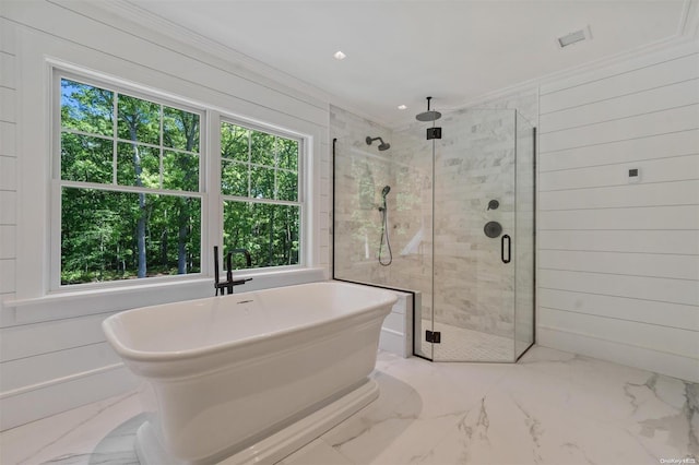 bathroom featuring crown molding, separate shower and tub, and wood walls