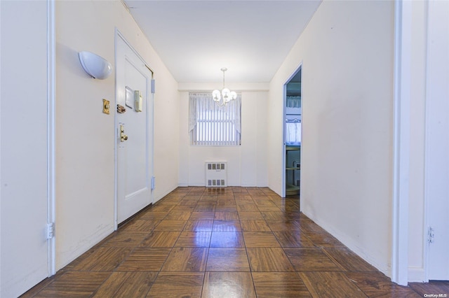 interior space with heating unit and an inviting chandelier