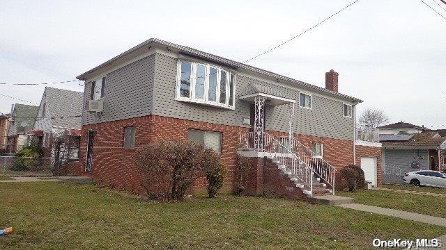 view of side of property with a yard