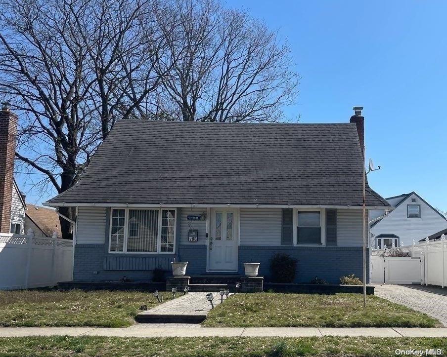 200 Raff Ave, Elmont, NY 11003 - view of front of property with brick siding and a chimney