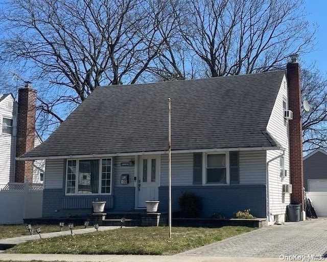 200 Raff Ave, Elmont, NY 11003 - view of front of home with an outdoor structure, a chimney, and brick siding