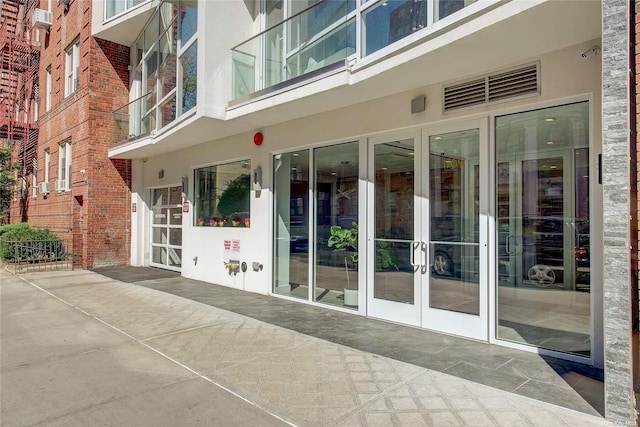 property entrance featuring french doors