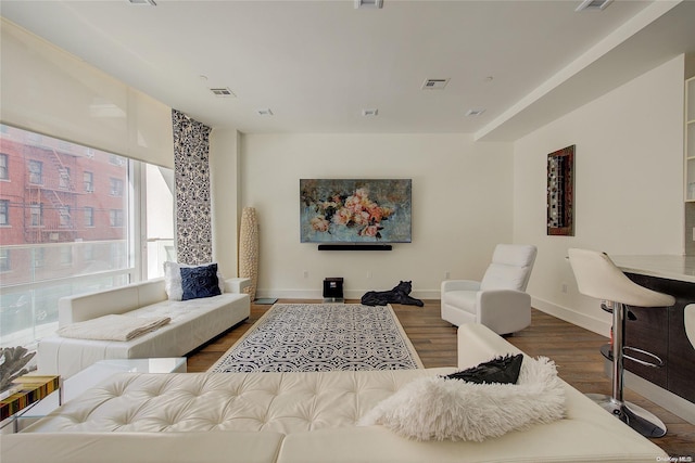 living room with dark hardwood / wood-style flooring