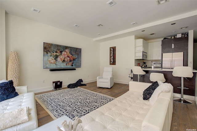 living room featuring dark wood-type flooring