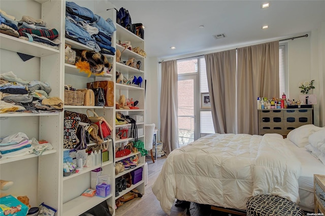 bedroom with hardwood / wood-style floors