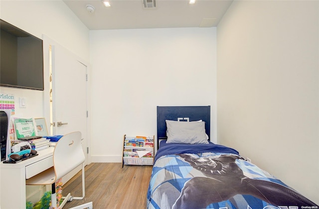 bedroom featuring light hardwood / wood-style floors