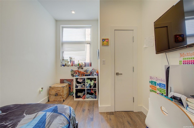 bedroom featuring hardwood / wood-style flooring