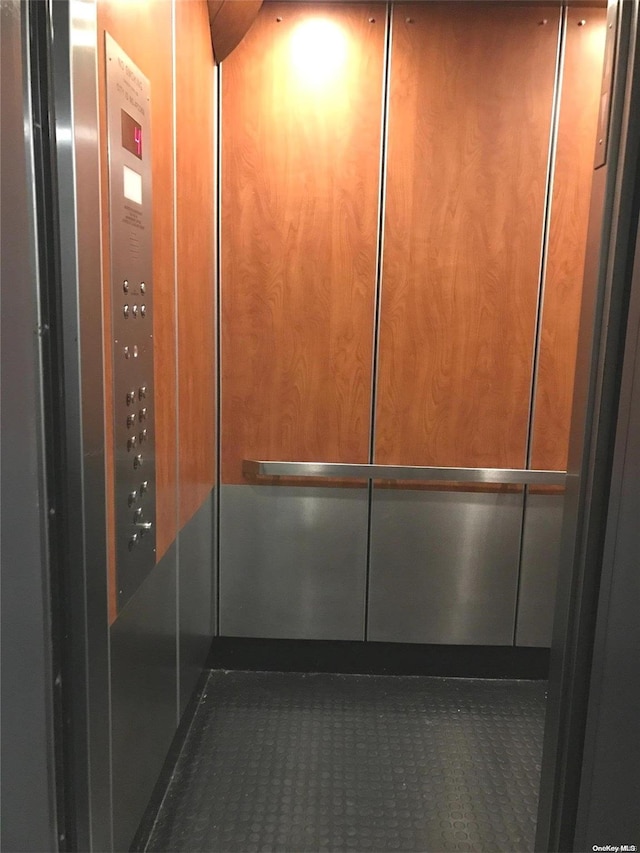 details with elevator and wood walls