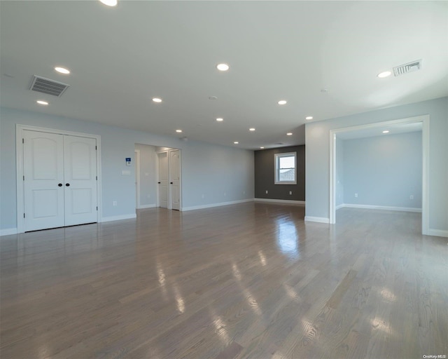 unfurnished room featuring dark hardwood / wood-style floors