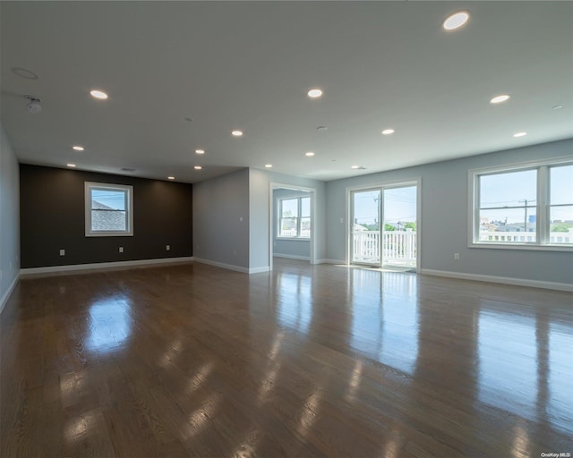 unfurnished room featuring dark hardwood / wood-style floors