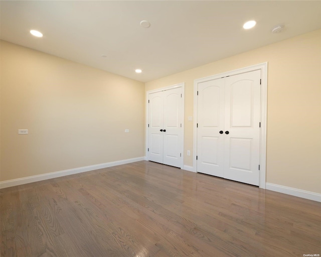 unfurnished bedroom featuring hardwood / wood-style flooring