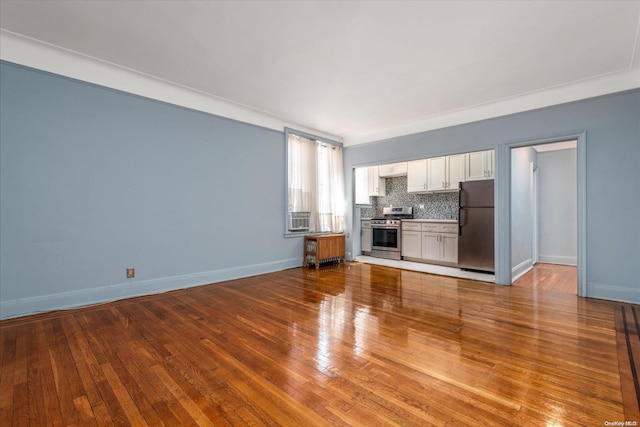 unfurnished living room with hardwood / wood-style flooring