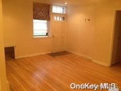 empty room featuring hardwood / wood-style flooring