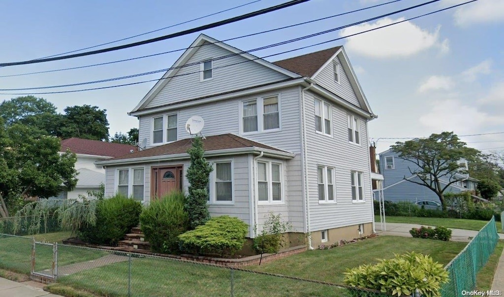 front facade with a front lawn