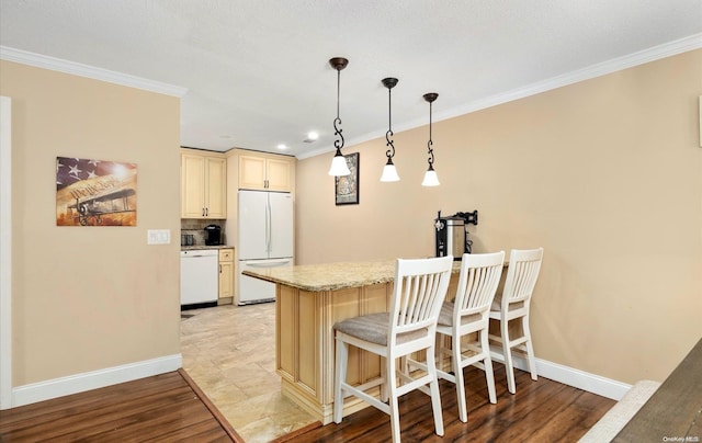 1016 Skyline Dr Unit 1016, Coram, NY 11727 - kitchen with white appliances, light hardwood / wood-style flooring, hanging light fixtures, and crown molding