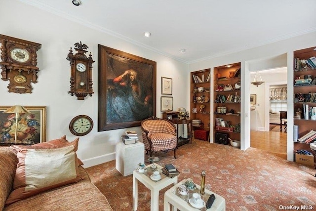 sitting room featuring crown molding and wood-type flooring