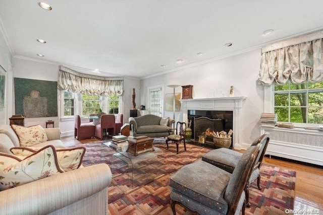 living room with ornamental molding and parquet floors