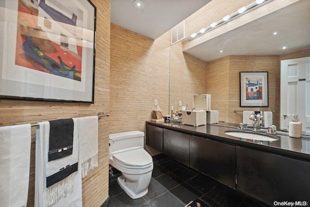 bathroom with tile patterned floors, vanity, and toilet