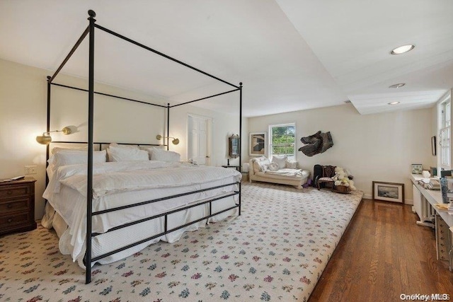 bedroom with hardwood / wood-style flooring