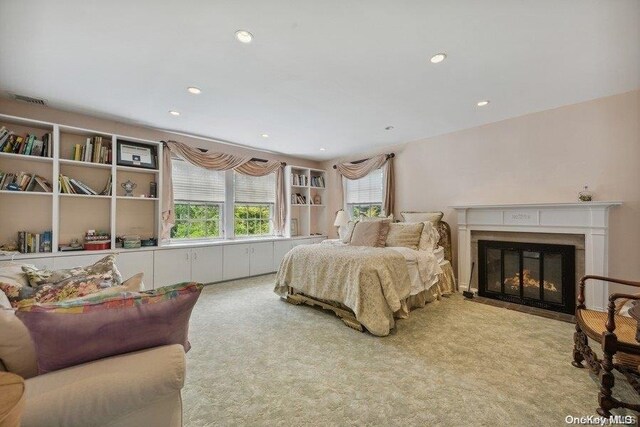 203 Albon Rd, Hewlett Harbor, NY 11557 - bedroom with carpet flooring, a fireplace with flush hearth, and recessed lighting