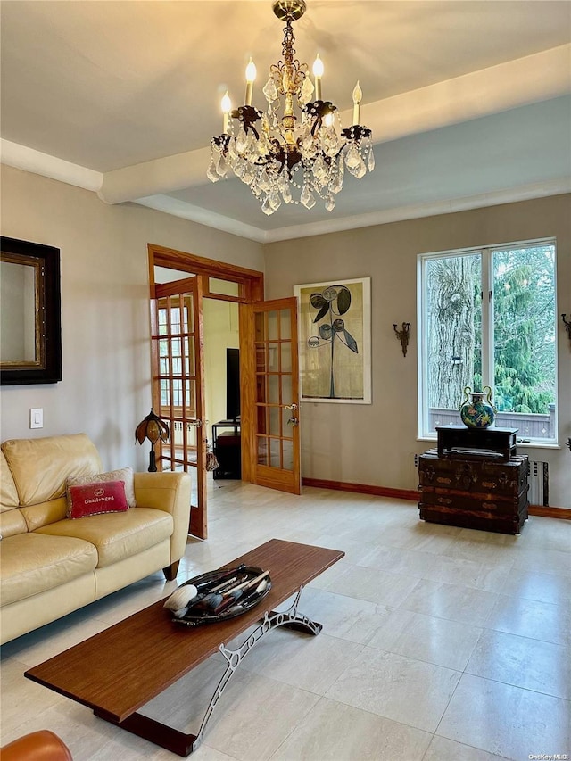 living room featuring french doors, radiator heating unit, and a notable chandelier