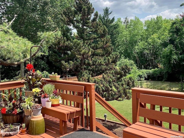 wooden deck with a yard