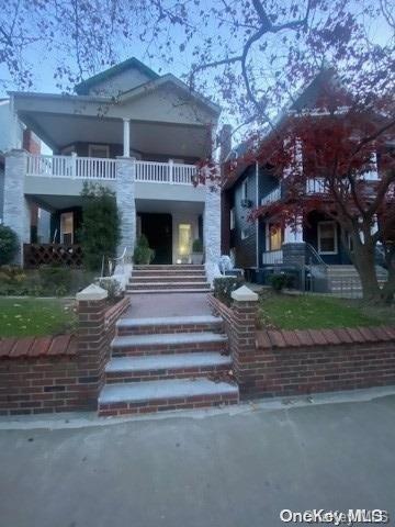 view of front of home with a balcony