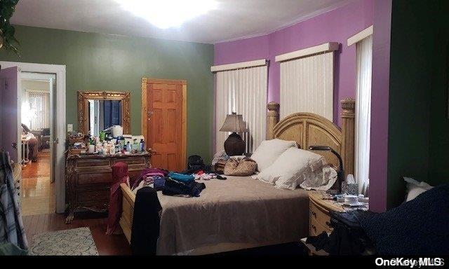 bedroom featuring hardwood / wood-style flooring