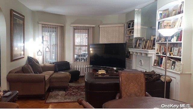 living room with parquet flooring