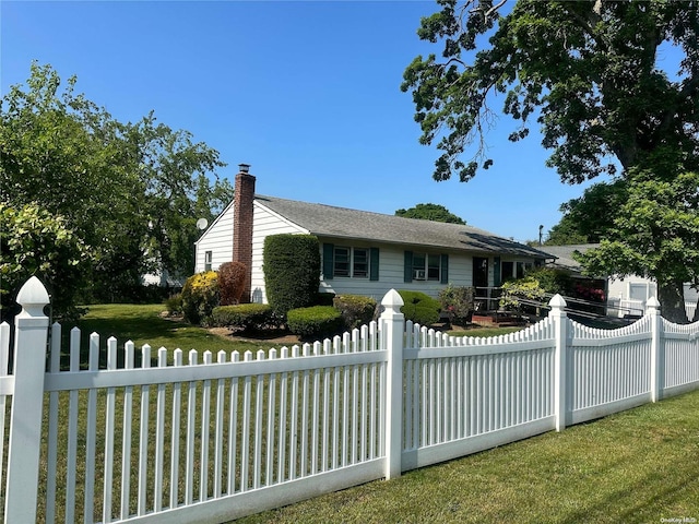 ranch-style house with a front lawn