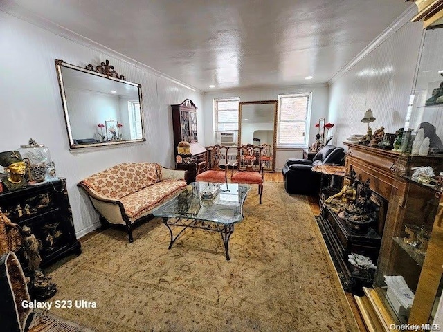 living room with crown molding, a fireplace, and cooling unit