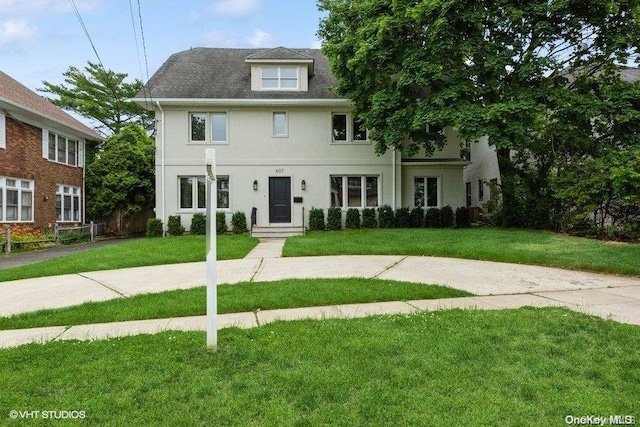 view of front of home featuring a front lawn