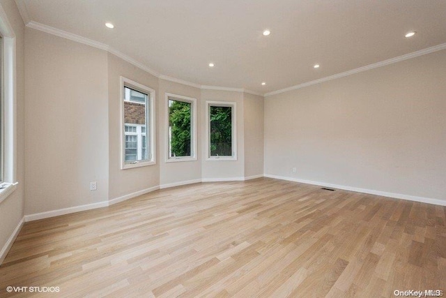 unfurnished room featuring light hardwood / wood-style flooring and ornamental molding