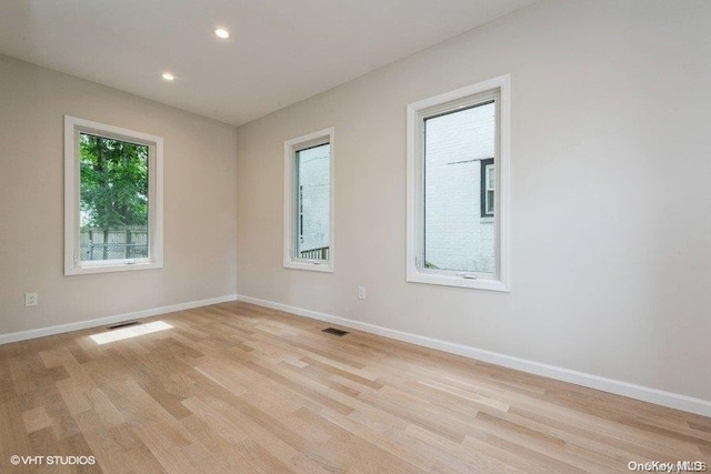 unfurnished room featuring light wood-type flooring