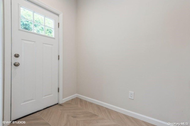 foyer with light parquet flooring