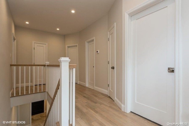 hallway with light hardwood / wood-style flooring