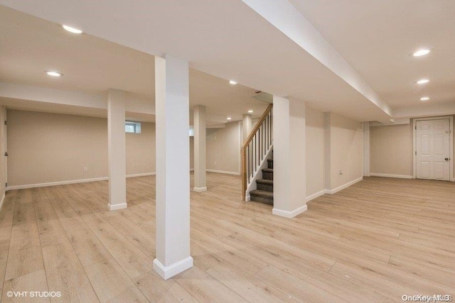 basement featuring light hardwood / wood-style flooring