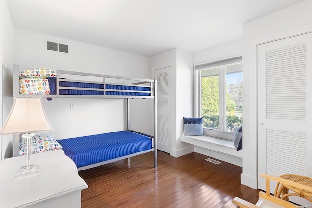 bedroom featuring dark hardwood / wood-style flooring