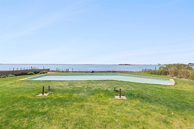 view of property's community featuring a lawn and a water view