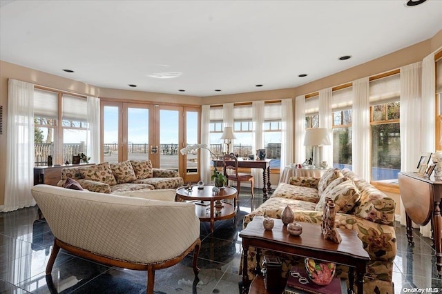 living room with plenty of natural light and french doors