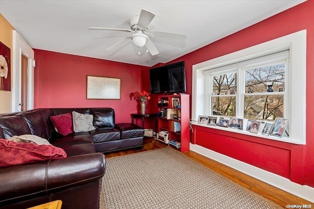 living room with ceiling fan and wood-type flooring