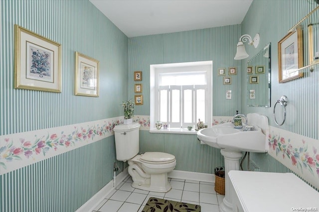 bathroom with tile patterned flooring and toilet