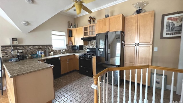 kitchen with tasteful backsplash, dark stone counters, crown molding, sink, and black appliances