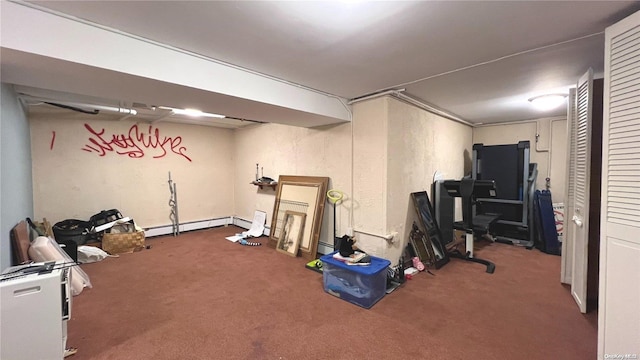 workout room with carpet floors and a baseboard heating unit