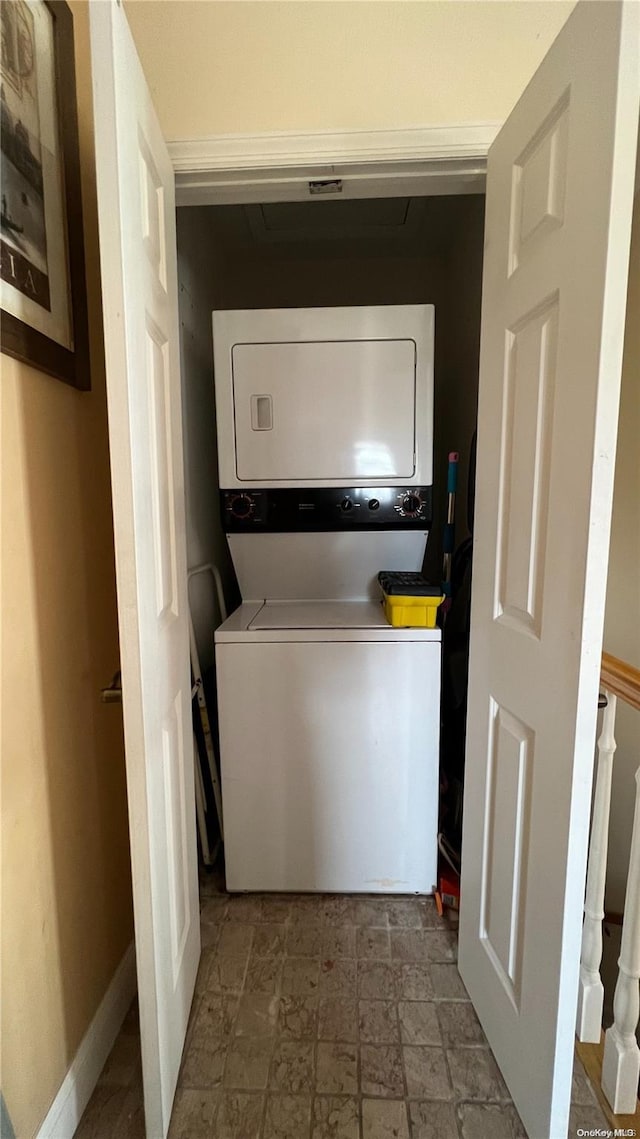 laundry area with stacked washer and dryer