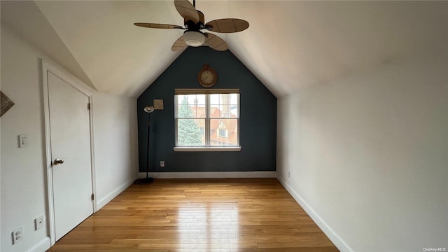 additional living space with ceiling fan, lofted ceiling, and light hardwood / wood-style flooring