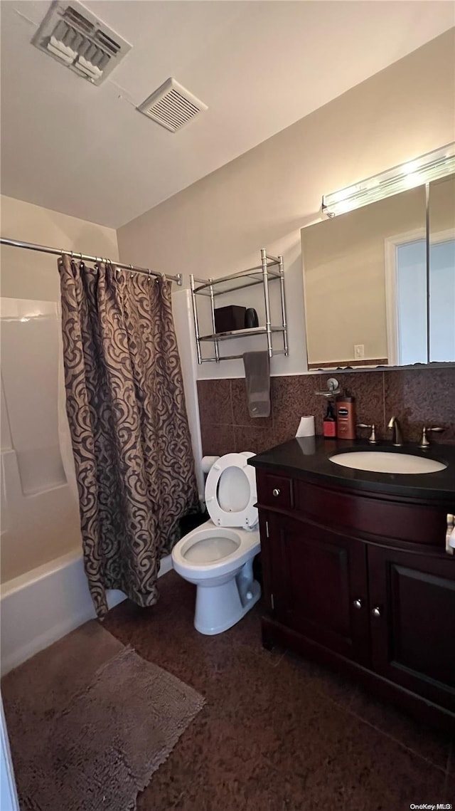 full bathroom with tasteful backsplash, vanity, shower / bath combination with curtain, and toilet